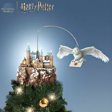 Load image into Gallery viewer, The Bradford Exchange HARRY POTTER HEDWIG Over HOGWARTS Illuminated Rotating Treetopper Hand-Painted HOGWARTS Castle and Sculpted HEDWIG with Snowy Feathers Golden Eyes and Snow-Dusted Mountain with Lights Music and Movement Christmas Decoration - RCE Global Solutions