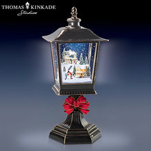 Load image into Gallery viewer, The Bradford Exchange Thomas Kinkade Holiday Continuous Snow Globe Illuminated Musical Black Lantern  Christmas Decoration Plays a Medley of 8 Holiday Songs With 24hr Timer 12-Inches - RCE Global Solutions