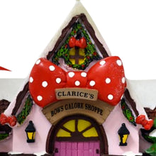 Load image into Gallery viewer, The Bradford Exchange Rudolph The Red-Nosed Reindeer Village Collection Issue #53 Clarice`s Holiday Bow Shoppe Christmas Village Display Illuminated Lighted Holiday Decor Hand Painted Sculpture 8.75-Inches