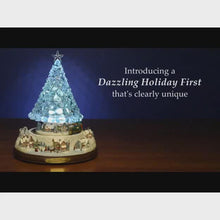 Load and play video in Gallery viewer, The Bradford Exchange Thomas Kinkade Art Inspired Reflections Of Christmas Genuine Crystal Tabletop Tree With Color Changing Lights Locomotive Motion Train and 8 Holiday Melodies Music 10"-Inches
