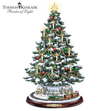 Load image into Gallery viewer, The Bradford Exchange Thomas Kinkade The Heart of Christmas Tree Handcrafted Holiday Decor with Illuminated LED Candles Sculpted Village Buildings Star Topper and Plays Music with Rotating Train 13"-Inches - RCE Global Solutions