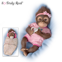 Load image into Gallery viewer, The Ashton - Drake Galleries Snuggle Suri Lifelike Baby Monkey Girl Doll With RealTouch® Vinyl Skin and Weighted Cloth Body Hand Applied Mohair Magnetic Pacifier Leopard Print Bunting 14"-inches - RCE Global Solutions
