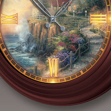 Load image into Gallery viewer, The Bradford Exchange Light of Peace Wall Clock Lighthouse Decor Atomic Clock with Copper-Toned Metal Housing Self-Setting Illuminating Artisan Hand-Applied Artwork Coastal Cottage Features The Light of Peace Scene by Thomas Kinkade 14" D - RCE Global Solutions

