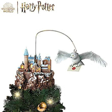 Load image into Gallery viewer, The Bradford Exchange HARRY POTTER HEDWIG Over HOGWARTS Illuminated Rotating Treetopper Hand-Painted HOGWARTS Castle and Sculpted HEDWIG with Snowy Feathers Golden Eyes and Snow-Dusted Mountain with Lights Music and Movement Christmas Decoration - RCE Global Solutions
