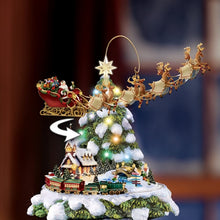 Load image into Gallery viewer, The Bradford Exchange Thomas Kinkade Wonderland Express Christmas Tree Decoration With Santa Sleigh Topper Lights Moving Train and Music With 8 Beloved Xmas Carols 16&quot;-Inches - RCE Global Solutions
