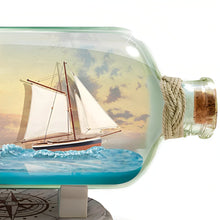 Load image into Gallery viewer, The Bradford Exchange Light of Hope Illuminated Ship-In-A-Bottle Sculpture Handcrafted Seascape Art with Illuminating Lighthouse Clear Glass Bottle and Compass Base by Thomas Kinkade 8.75&quot; L x 5.5&quot; H x 4.75&quot; D - RCE Global Solutions
