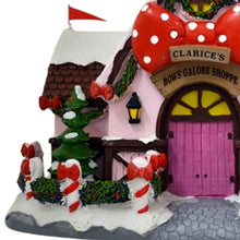 Load image into Gallery viewer, The Bradford Exchange Rudolph The Red-Nosed Reindeer Village Collection Issue #53 Clarice`s Holiday Bow Shoppe Christmas Village Display Illuminated Lighted Holiday Decor Hand Painted Sculpture 8.75-Inches
