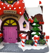 Load image into Gallery viewer, The Bradford Exchange Rudolph The Red-Nosed Reindeer Village Collection Issue #53 Clarice`s Holiday Bow Shoppe Christmas Village Display Illuminated Lighted Holiday Decor Hand Painted Sculpture 8.75-Inches
