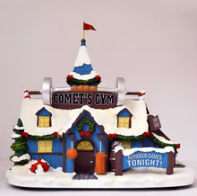 Load image into Gallery viewer, The Bradford Exchange Rudolph The Red-Nosed Reindeer Village Collection Issue #51: Coach Comet Reindeer Games Village Display Illuminated Lighted Holiday Decor Hand Painted Collectible Sculpture 8-inches
