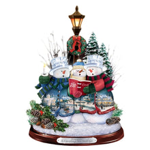 Load image into Gallery viewer, The Bradford Exchange &quot;A Caroling We Will Go&quot; Crystal Snowman Trio Illuminated Hand-crafted Sculpture Christmas Decoration with Holiday Artwork by Thomas Kinkade 10-inches - RCE Global Solutions
