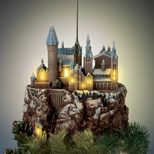 Load image into Gallery viewer, The Bradford Exchange HARRY POTTER HEDWIG Over HOGWARTS Illuminated Rotating Treetopper Hand-Painted HOGWARTS Castle and Sculpted HEDWIG with Snowy Feathers Golden Eyes and Snow-Dusted Mountain with Lights Music and Movement Christmas Decoration - RCE Global Solutions
