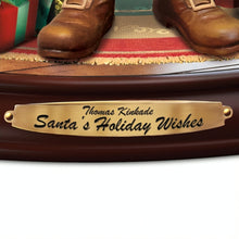 Load image into Gallery viewer, The Bradford Exchange Santas Holiday Wishes Sculpture Hand-Painted Hand-Cast Resin Figurine Christmas Decoration Plays 8 Holiday Carols Features Crackling Fireplace Effect Illuminated Tree and Merry Christmas Banner by Thomas Kinkade 10-inches - RCE Global Solutions
