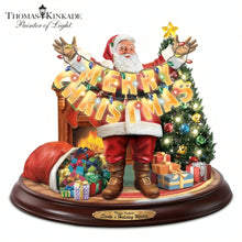 Load image into Gallery viewer, The Bradford Exchange Santas Holiday Wishes Sculpture Hand-Painted Hand-Cast Resin Figurine Christmas Decoration Plays 8 Holiday Carols Features Crackling Fireplace Effect Illuminated Tree and Merry Christmas Banner by Thomas Kinkade 10-inches - RCE Global Solutions
