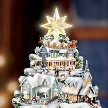 Load image into Gallery viewer, The Bradford Exchange Thomas Kinkade Songs Of The Season Illuminated Musical Tabletop Christmas Tree Decoration with 8 Fully Sculptural Buildings That Light Up With 8 Holiday Xmas Melodies 12&quot;-Inches
