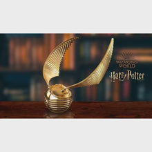 Load and play video in Gallery viewer, The Bradford Exchange Harry Potter Golden Snitch Cast Metal Music Box Featuring A Recreation of Marvolo Gaunt&#39;s Ring Inside Plays Hedwig&#39;s Theme Song 6&quot;-Inches
